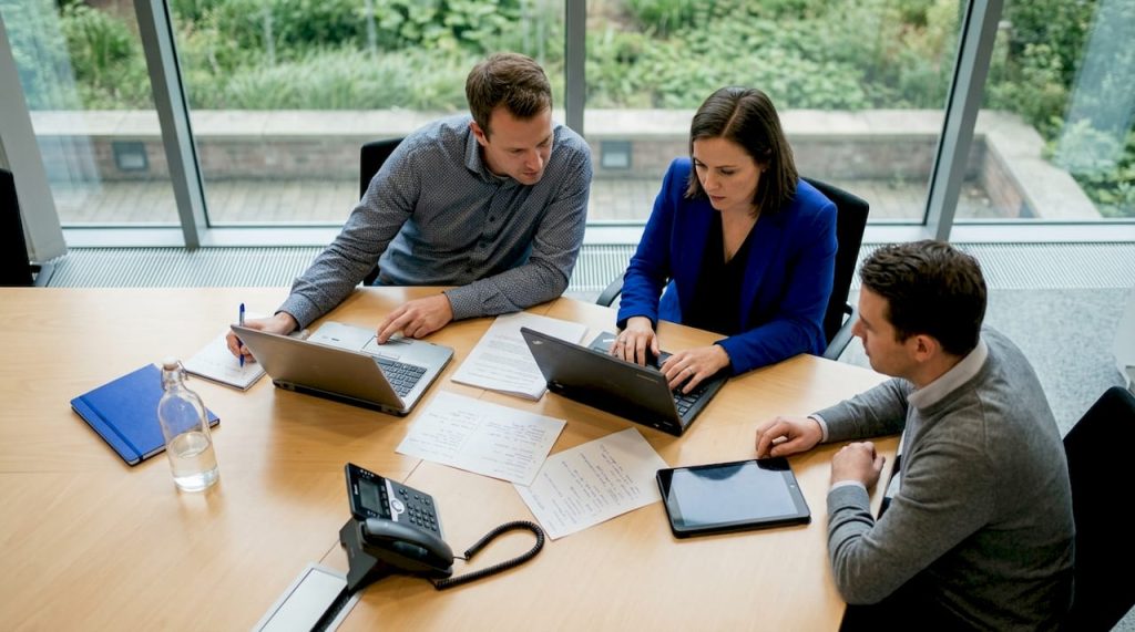 Team reviewing SaaS options in government office