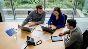 Team reviewing SaaS options in government office