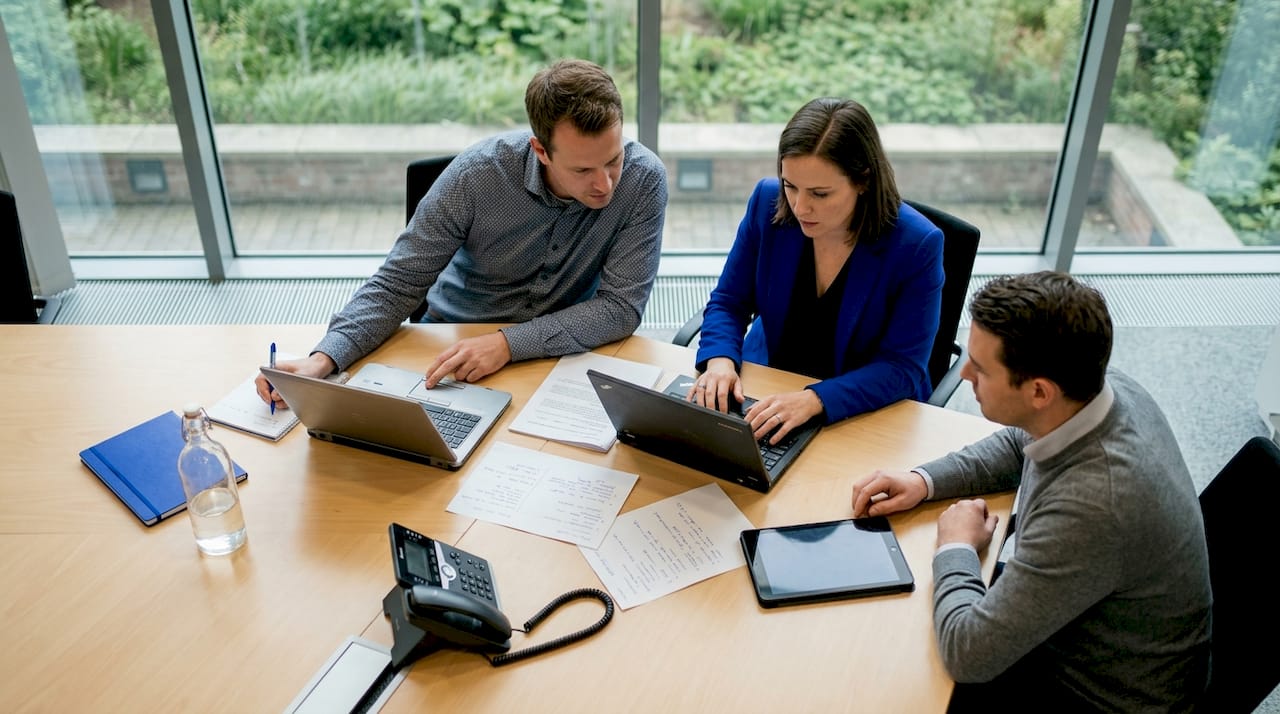 Team reviewing SaaS options in government office