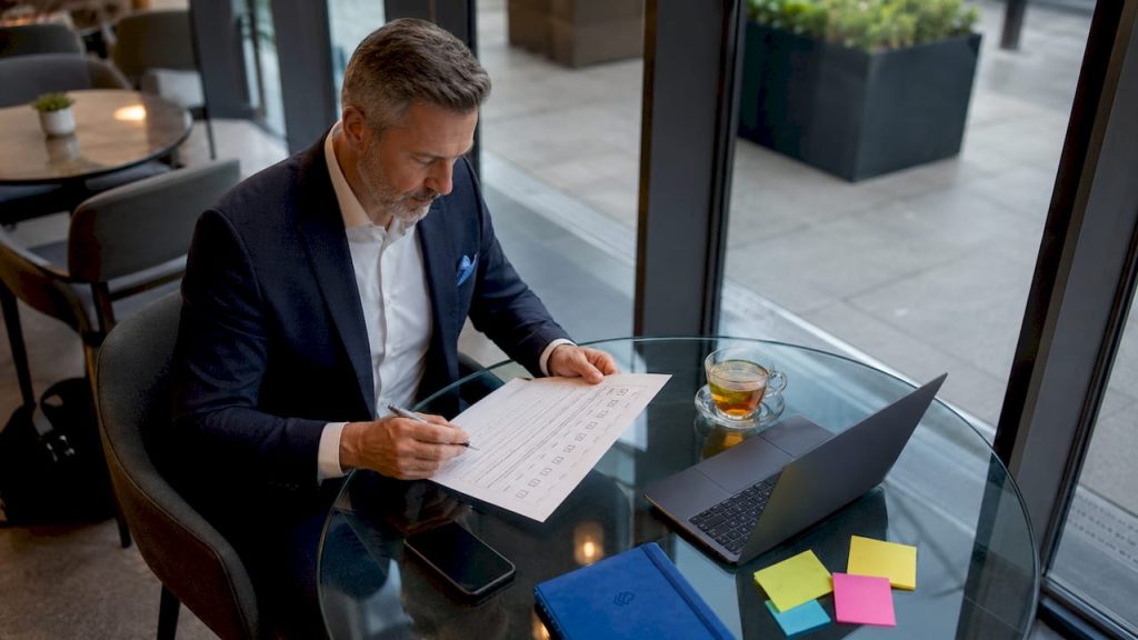 C-level executive reviewing software checklist