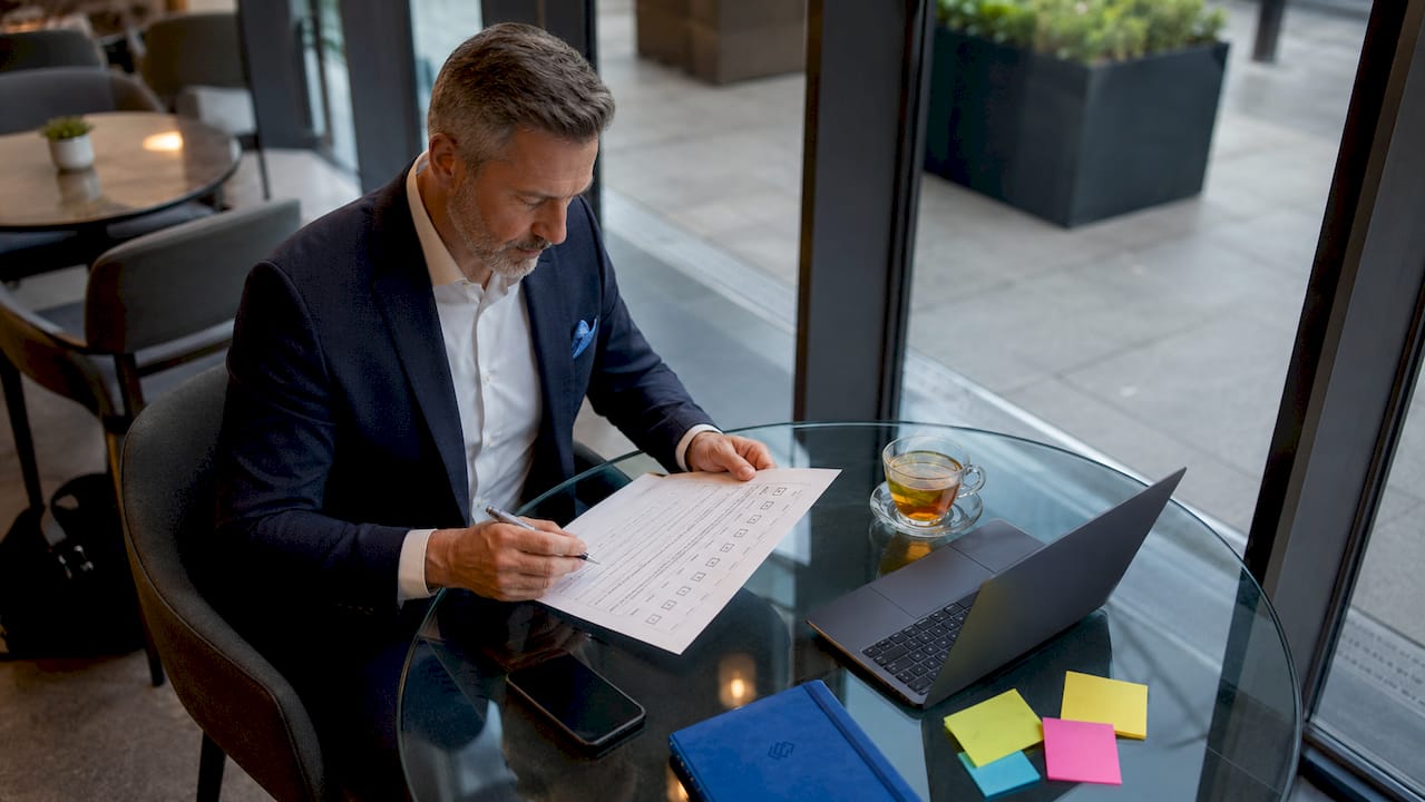 C-level executive reviewing software checklist