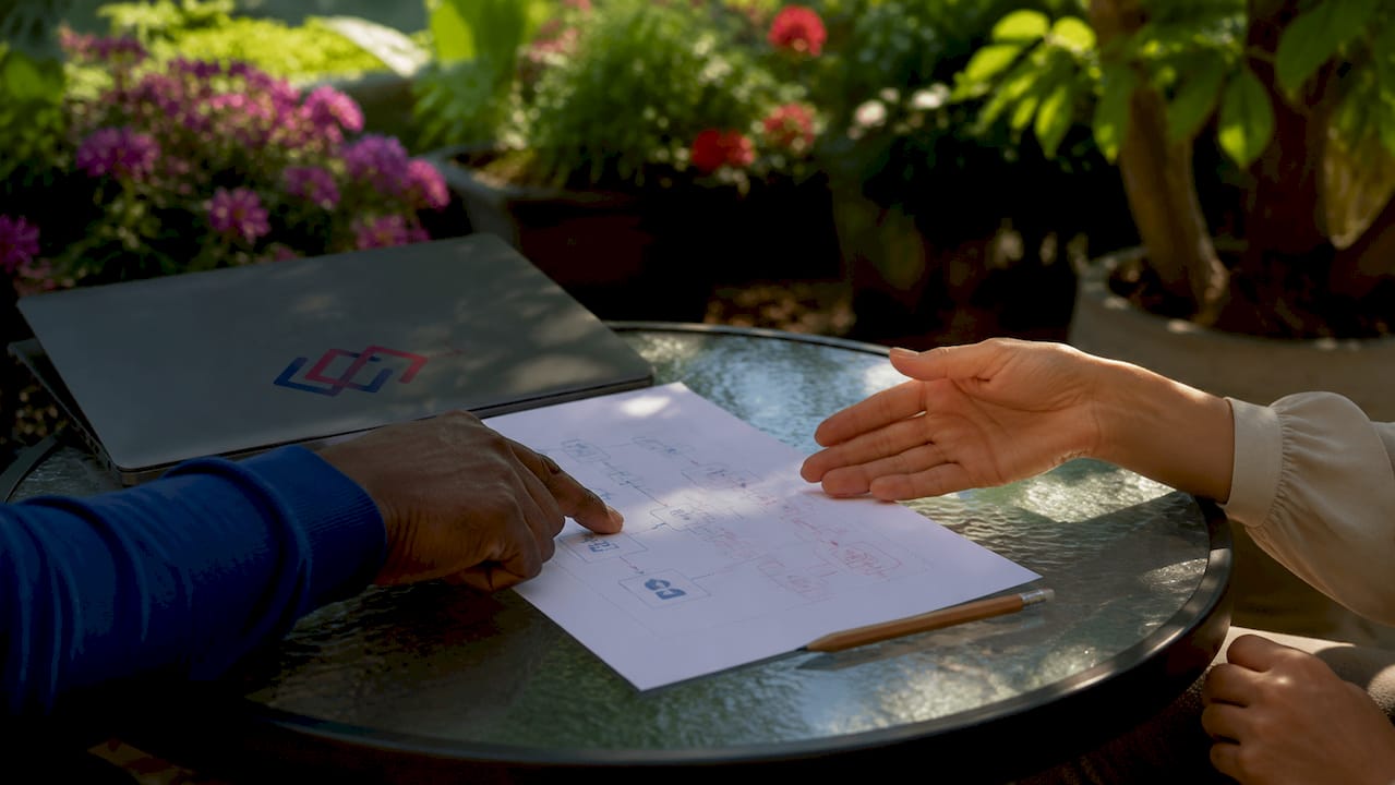 Hands pointing at ERP CRM integration diagram