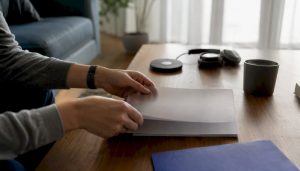 Hands placing adoption checklist on tablet