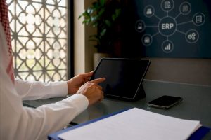 Finance professional using tablet in modern office
