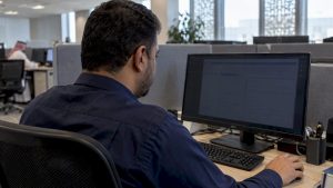 Saudi caseworker reviewing a citizen case